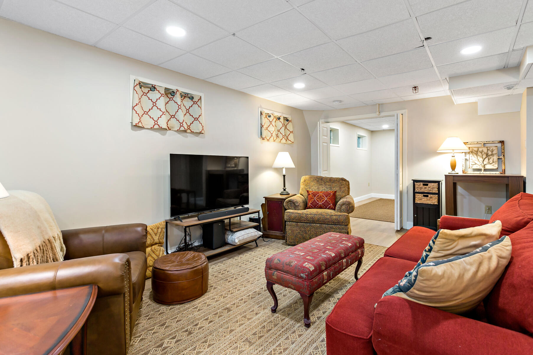 6 Friendship Court Mashpee, MA 02649 - Photo 20 of 39 a living room with furniture a rug and a flat screen tv