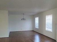 3459 Monte Carlo Street Dallas, TX 75224 - Photo 4 of 23 an empty room with wooden floor and windows