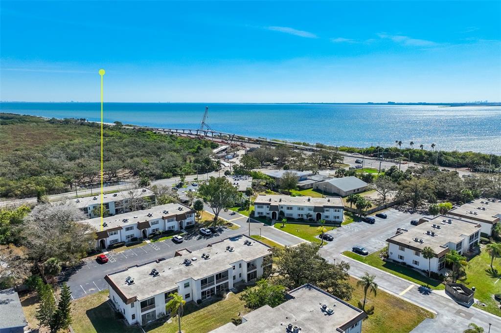 an aerial view of a building with an ocean