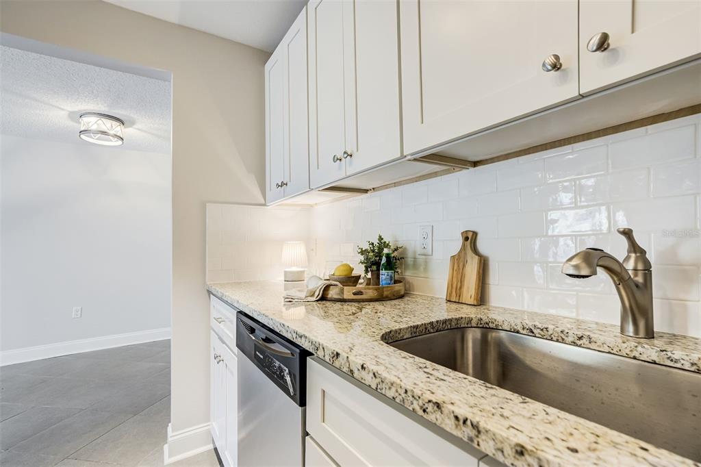 243 South McMullen Booth Road, Unit 29 Clearwater, FL 33759 - Photo 2 of 20 a kitchen with a sink and cabinets