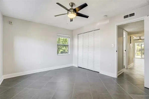 a view of an empty room and a window