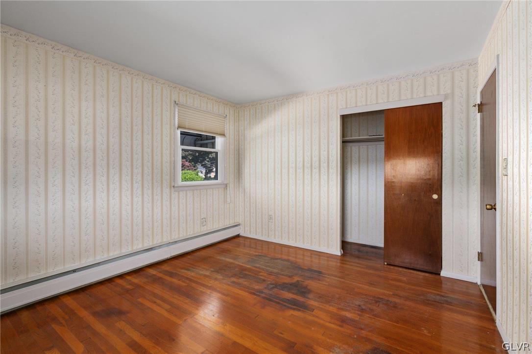 128 7th Street Whitehall, PA 18052 - Photo 12 of 29 an empty room with wooden floor and windows