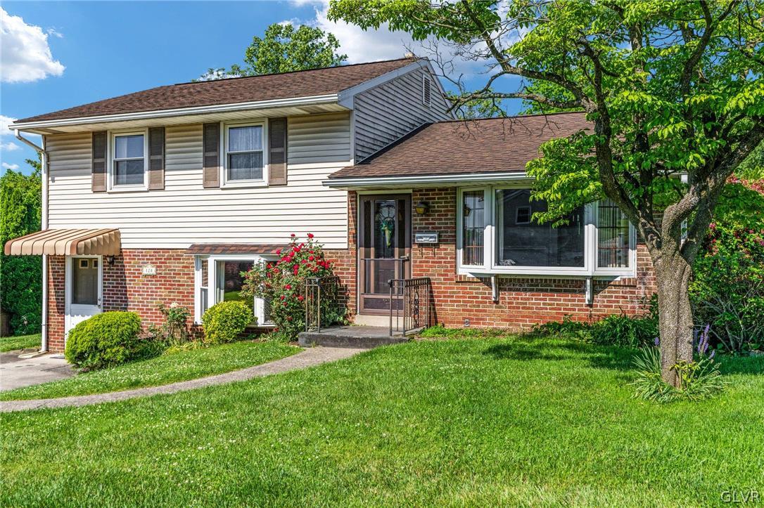 128 7th Street Whitehall, PA 18052 - Photo 3 of 29 a front view of a house with a yard