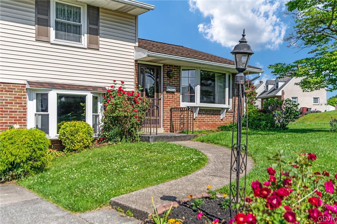 128 7th Street Whitehall, PA 18052 - Photo 4 of 29 a view of a house with a yard and garden