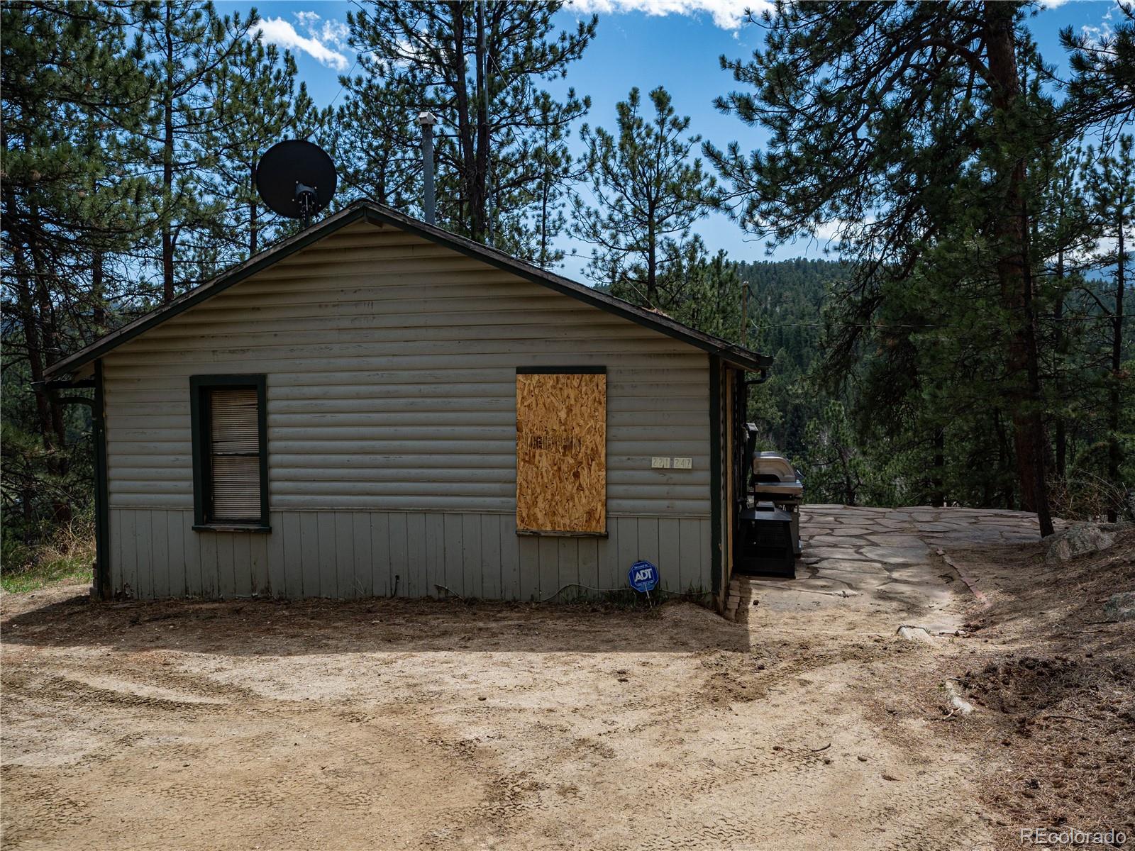 470 Mesa Drive Evergreen, CO 80439 - Photo 3 of 28 a backyard of a house with lots of green space