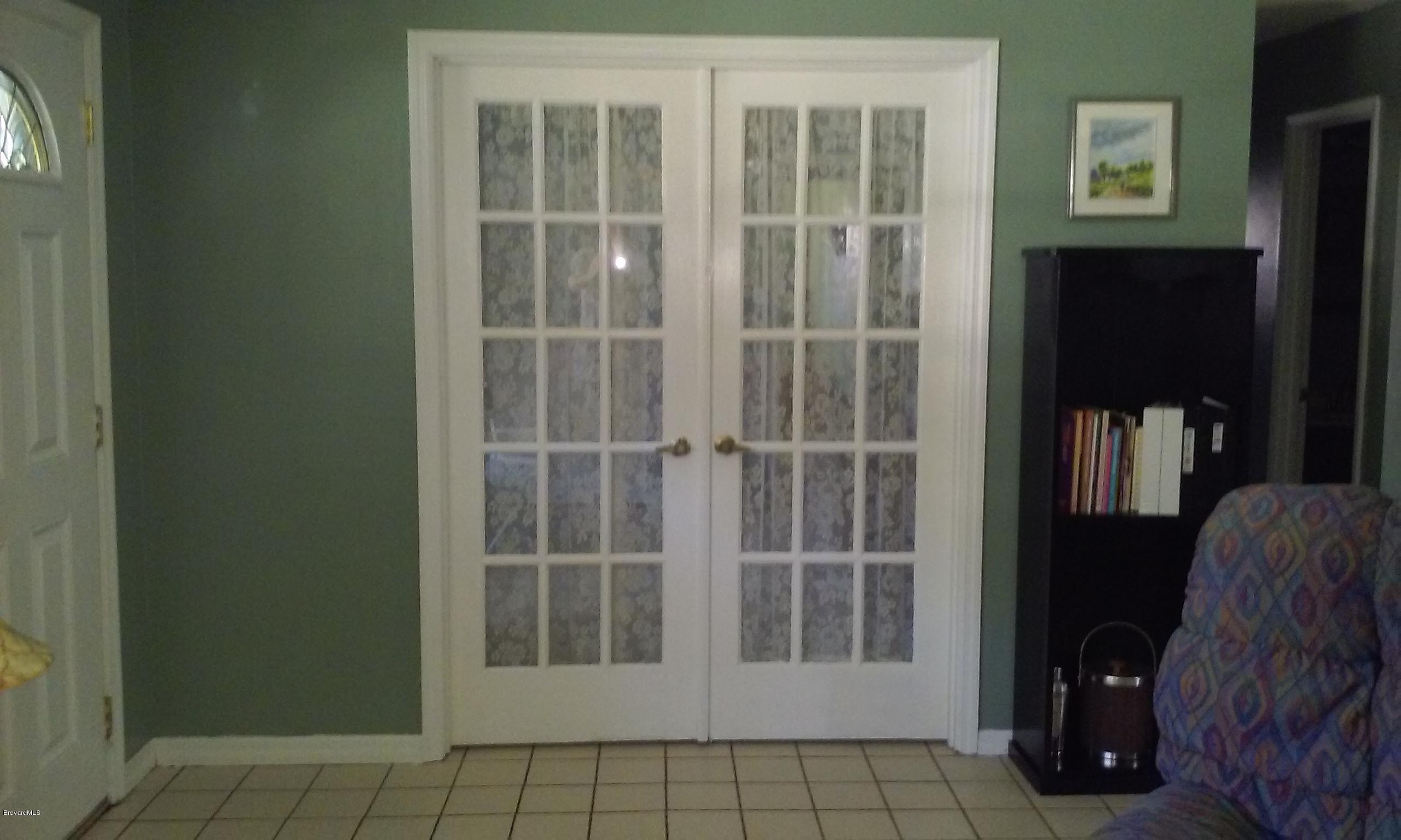 1294 Ne Port Palm Bay, FL 32905 - Photo 5 of 26 FRENCH DOORS TO 3RD BEDROOM OR DEN