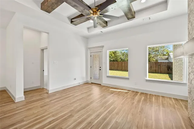 a view of kitchen with cabinets and wooden floor