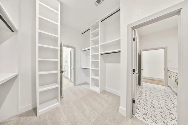 a large white tub sitting next to a bathroom sink