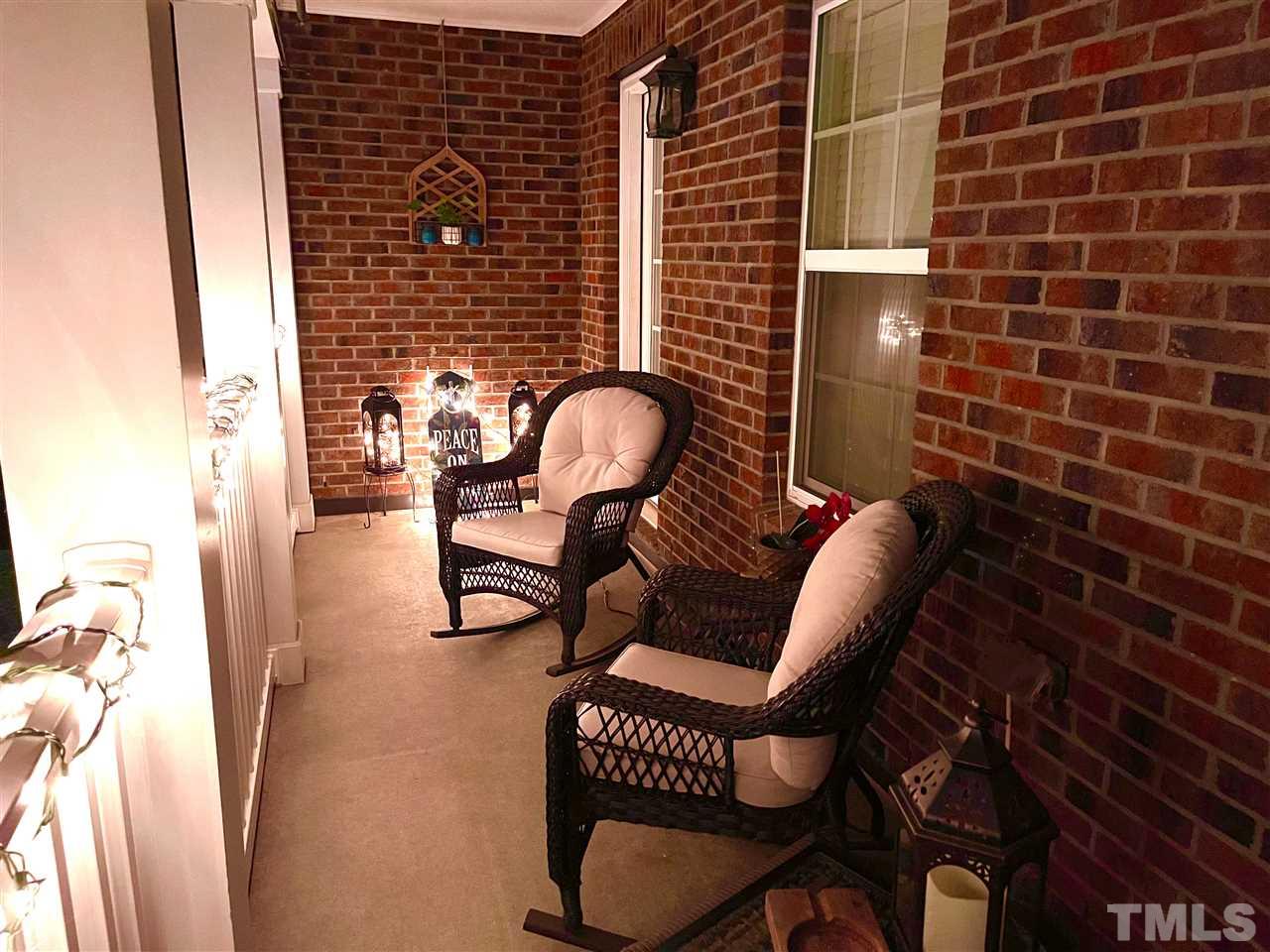 1368 Regulator Street Raleigh, NC 27603 - Photo 15 of 18 a living room with furniture a rug and a wooden floor