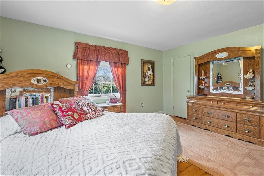 123 Buttercup Road Butler, PA 16001 - Photo 7 of 25 a bedroom with a bed and a dresser