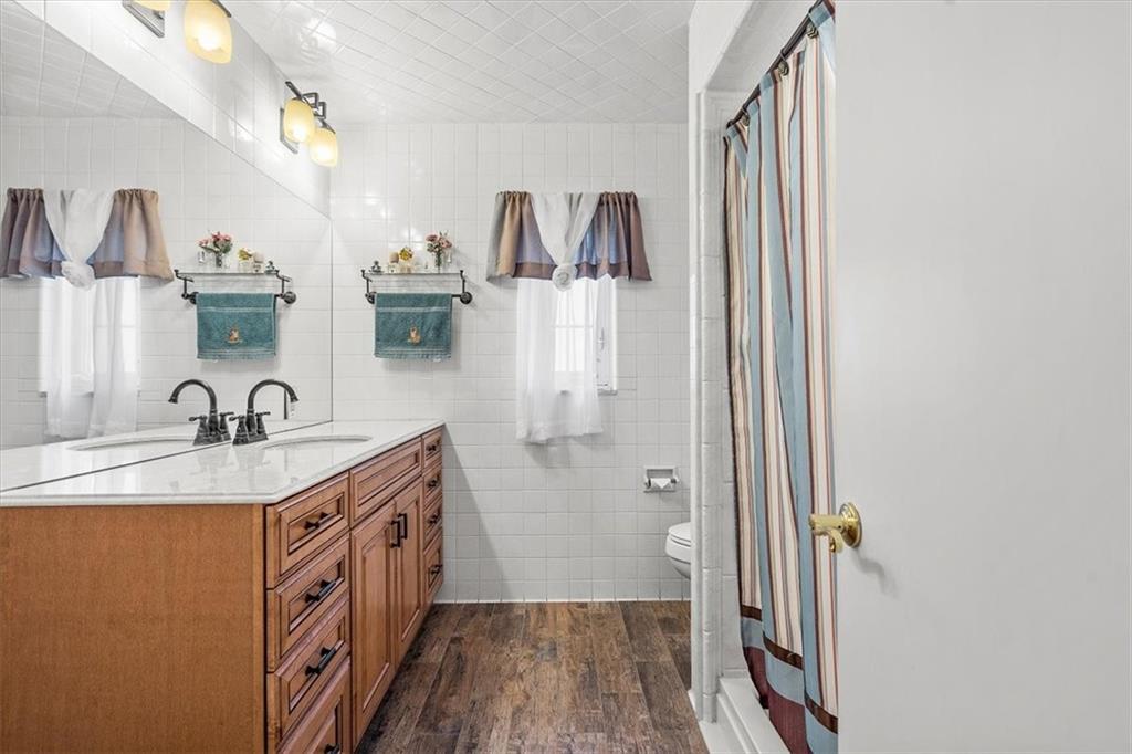 123 Buttercup Road Butler, PA 16001 - Photo 8 of 25 a spacious bathroom with a sink and mirror