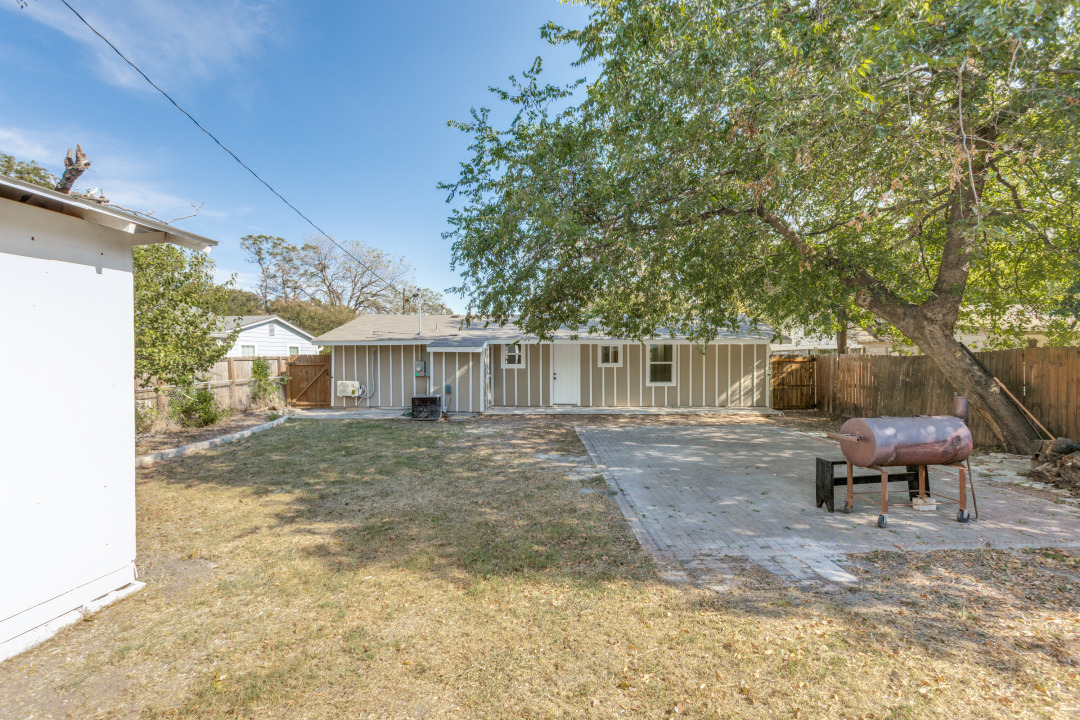 1118 Spur Street Austin, TX 78721 - Photo 24 of 27 Fenced backyard with a patio area