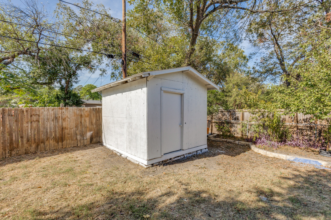 1118 Spur Street Austin, TX 78721 - Photo 25 of 27 View of shed featuring a fenced backyard