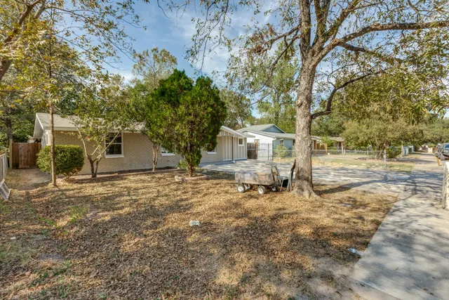 a house with trees in the background