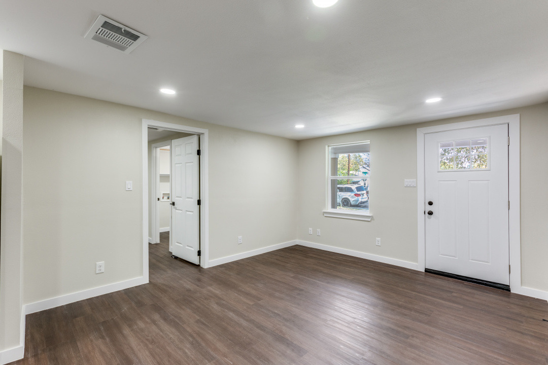1118 Spur Street Austin, TX 78721 - Photo 9 of 27 Living room featuring recessed lighting and dark wood-type flooring