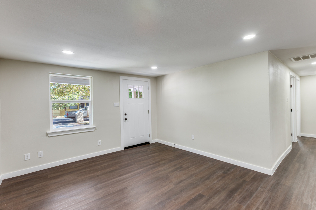 1118 Spur Street Austin, TX 78721 - Photo 10 of 27 Living room featuring recessed lighting and dark wood finished floors