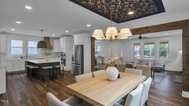 a kitchen with a sink and a potted plant