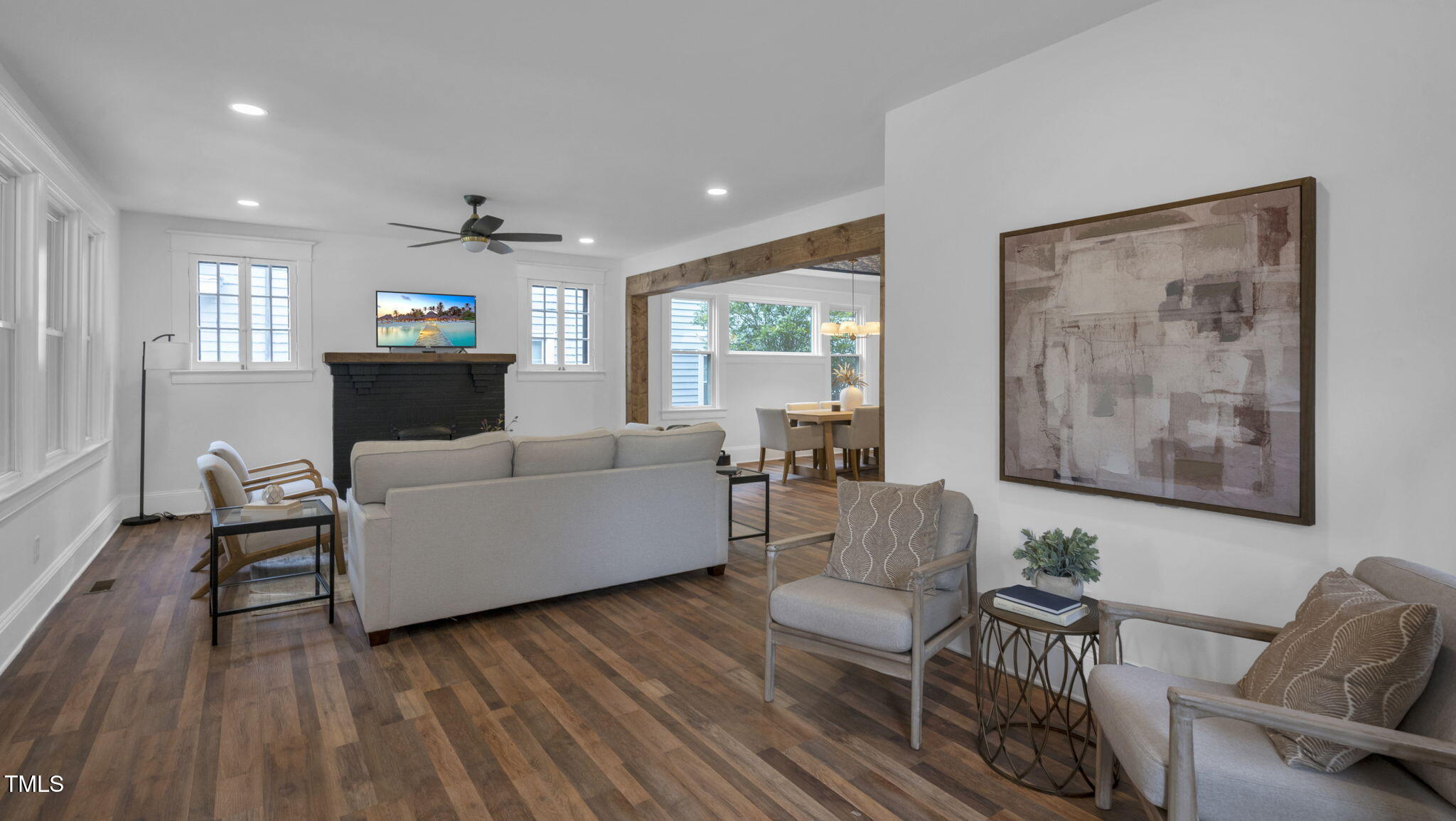 1307 Wake Forest Road Raleigh, NC 27604 - Photo 15 of 52 a living room with furniture and a wooden floor