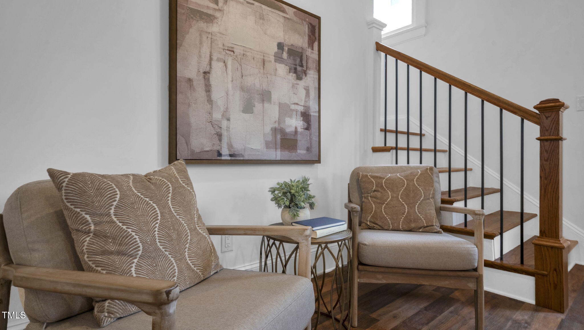 1307 Wake Forest Road Raleigh, NC 27604 - Photo 17 of 52 a living room with furniture and a painting on the wall