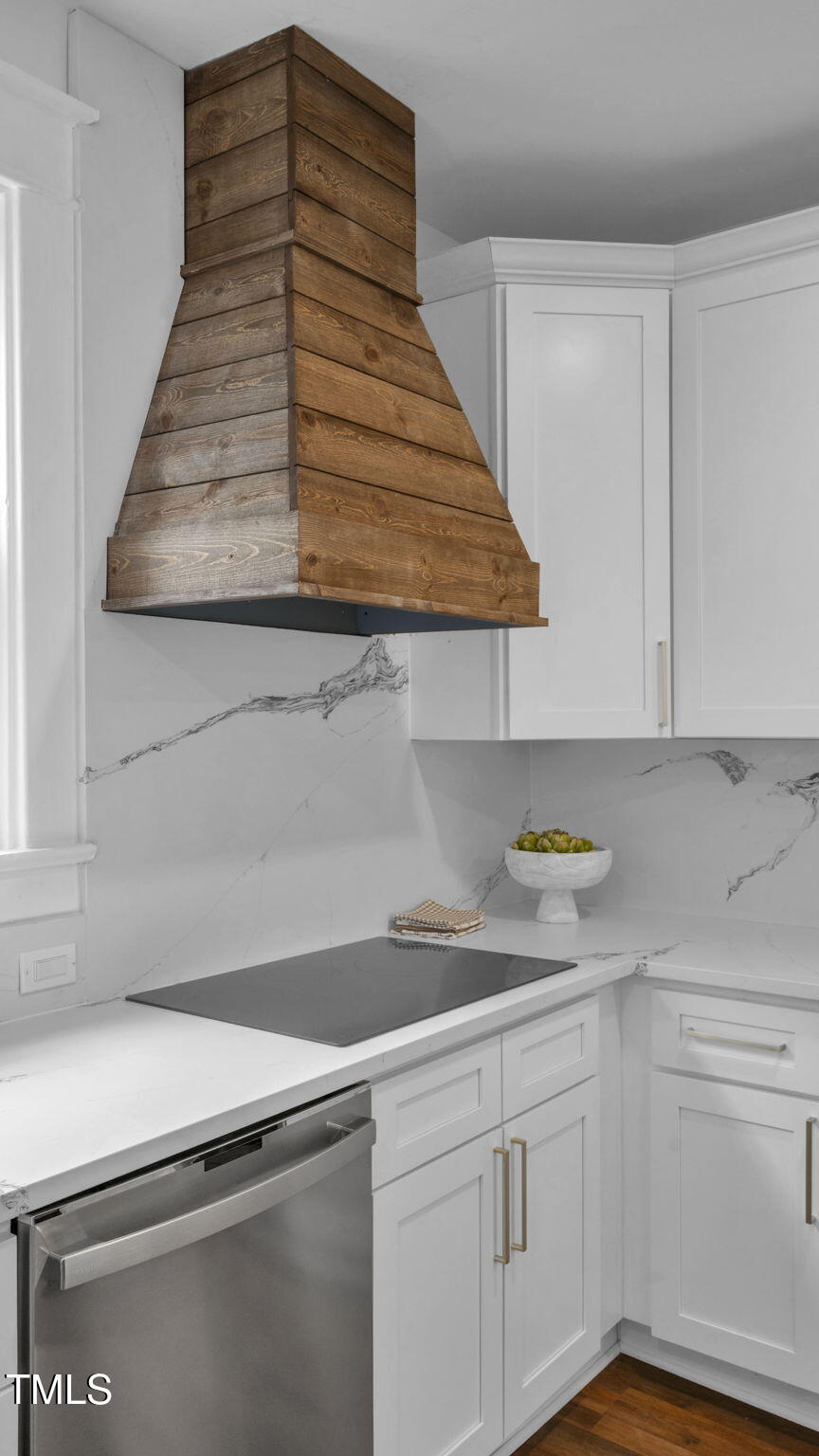 1307 Wake Forest Road Raleigh, NC 27604 - Photo 25 of 52 a kitchen with white cabinets and sink