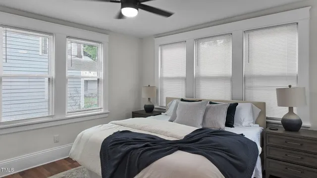 a living room with furniture a chandelier and a fireplace