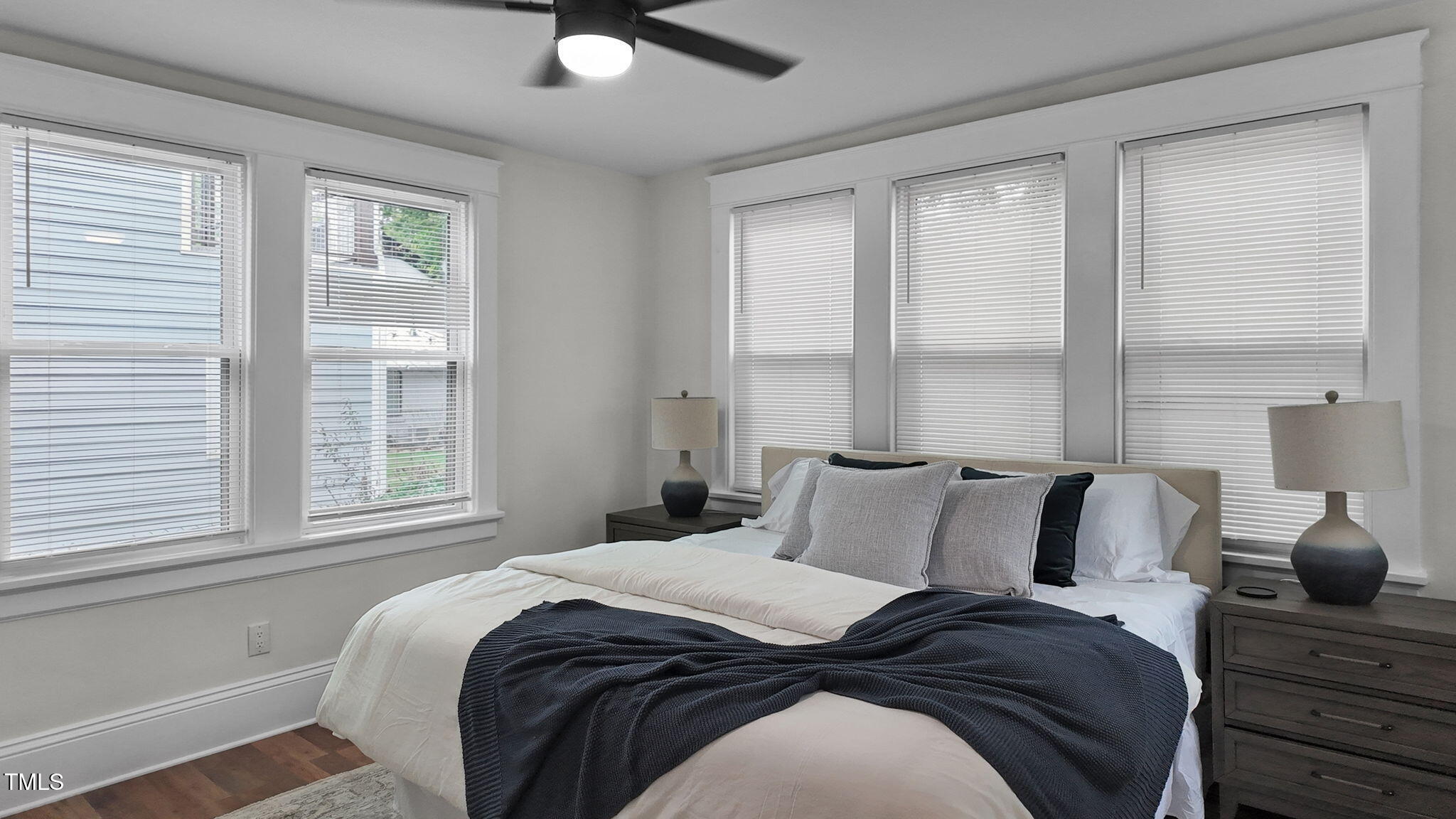 1307 Wake Forest Road Raleigh, NC 27604 - Photo 27 of 52 a bedroom with a bed and window