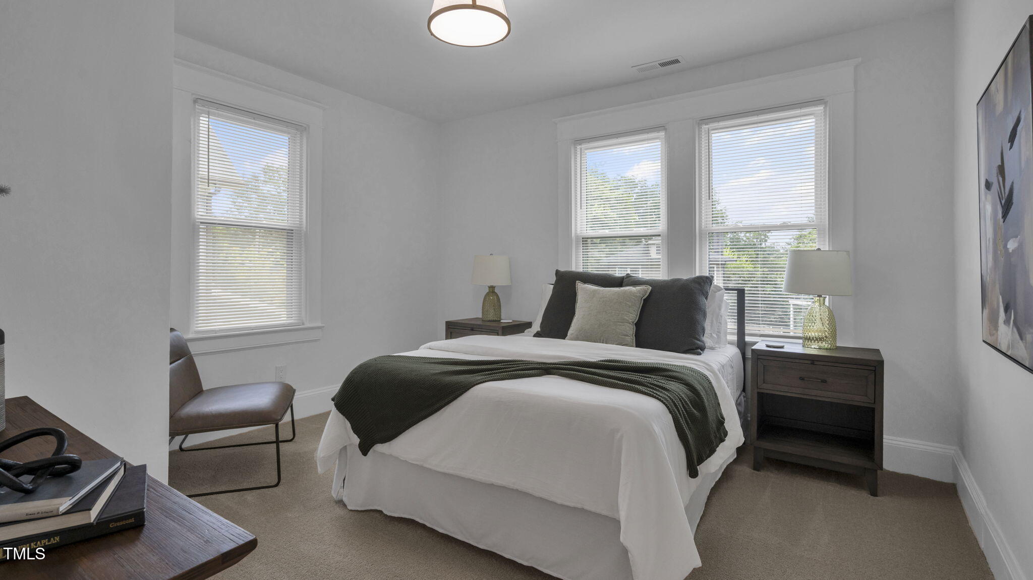 1307 Wake Forest Road Raleigh, NC 27604 - Photo 30 of 52 a bedroom with a bed and a window