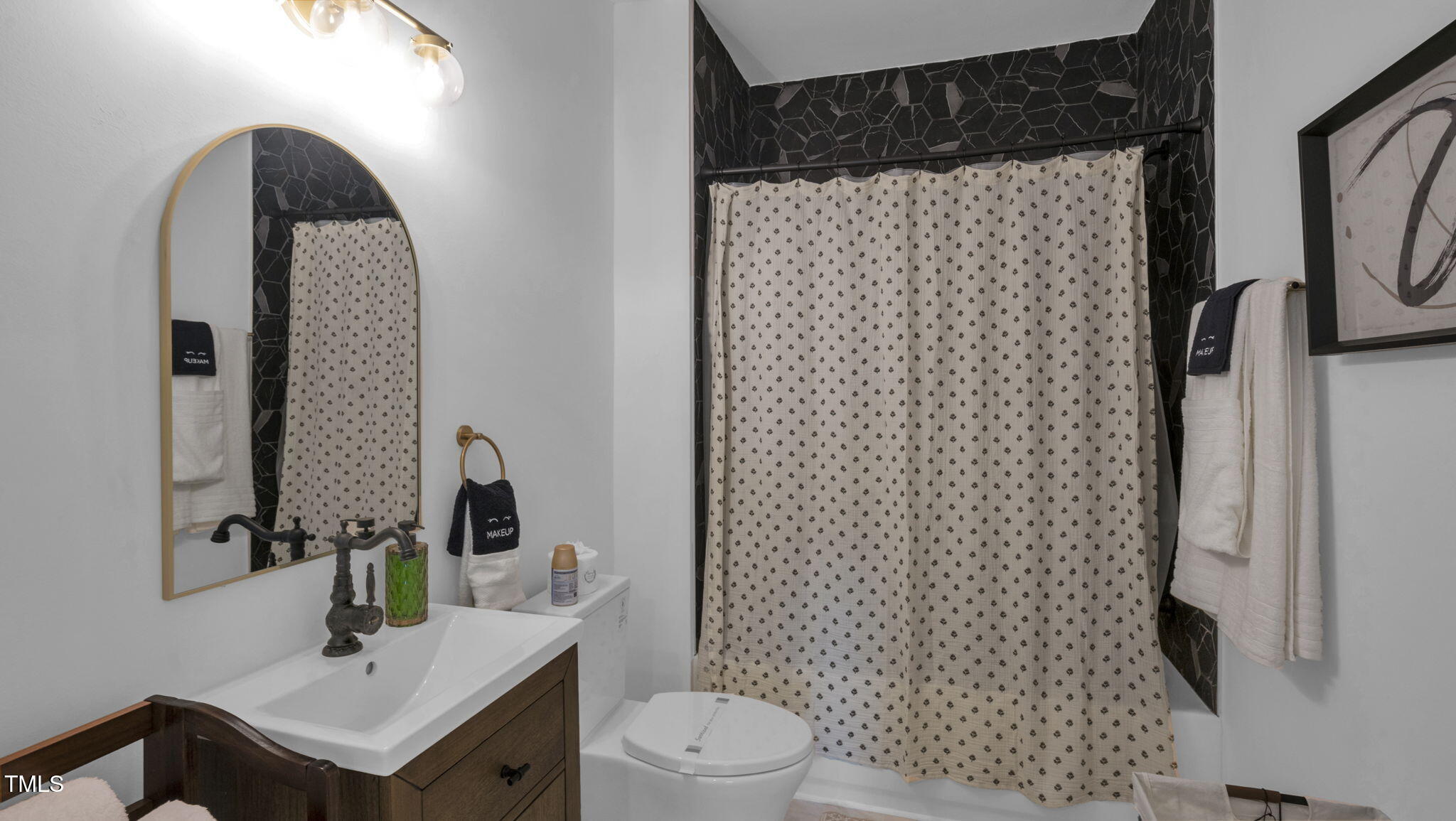 1307 Wake Forest Road Raleigh, NC 27604 - Photo 37 of 52 a bathroom with a sink toilet and shower