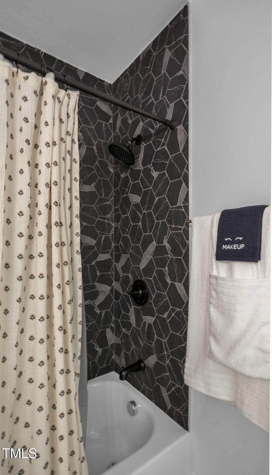 1307 Wake Forest Road Raleigh, NC 27604 - Photo 39 of 52 a bathroom with a shower and a toilet