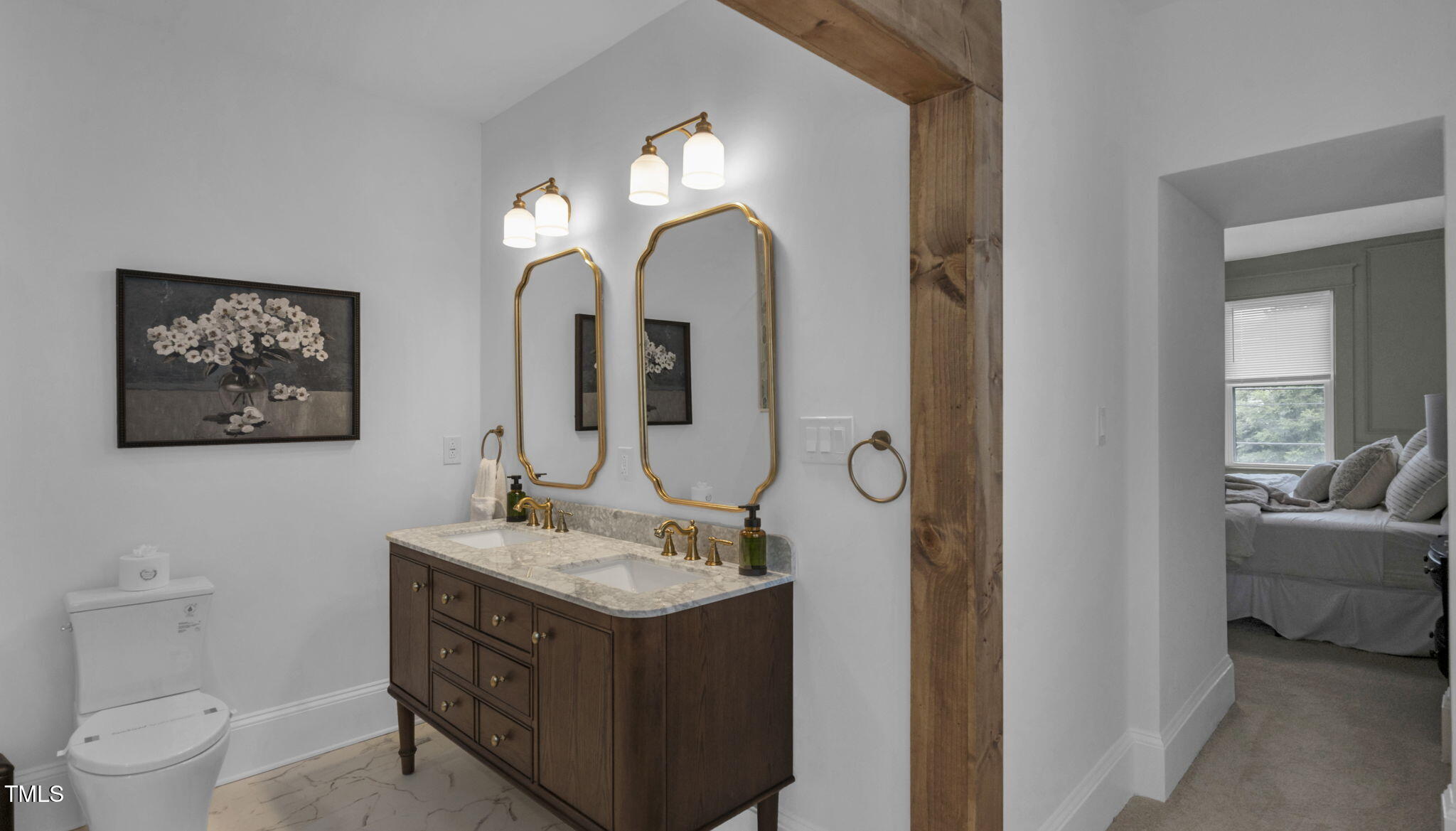 1307 Wake Forest Road Raleigh, NC 27604 - Photo 42 of 52 a bathroom with a toilet sink and mirror