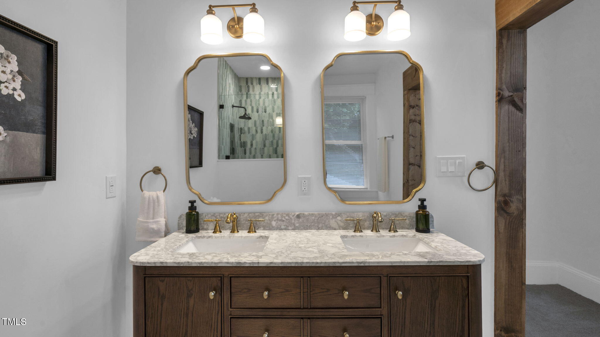 1307 Wake Forest Road Raleigh, NC 27604 - Photo 43 of 52 a bathroom with a granite countertop sink and a mirror