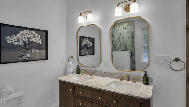a view of a bathroom with a shower and a sink