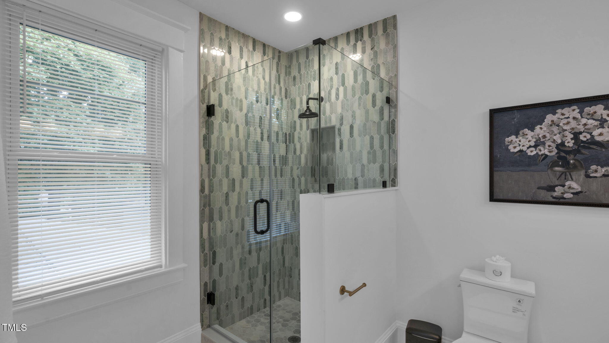1307 Wake Forest Road Raleigh, NC 27604 - Photo 45 of 52 a view of a bathroom with a shower and a sink