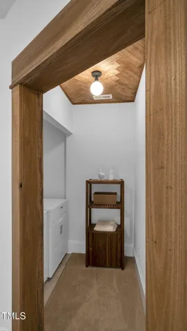 a backyard of a house with a table and chairs