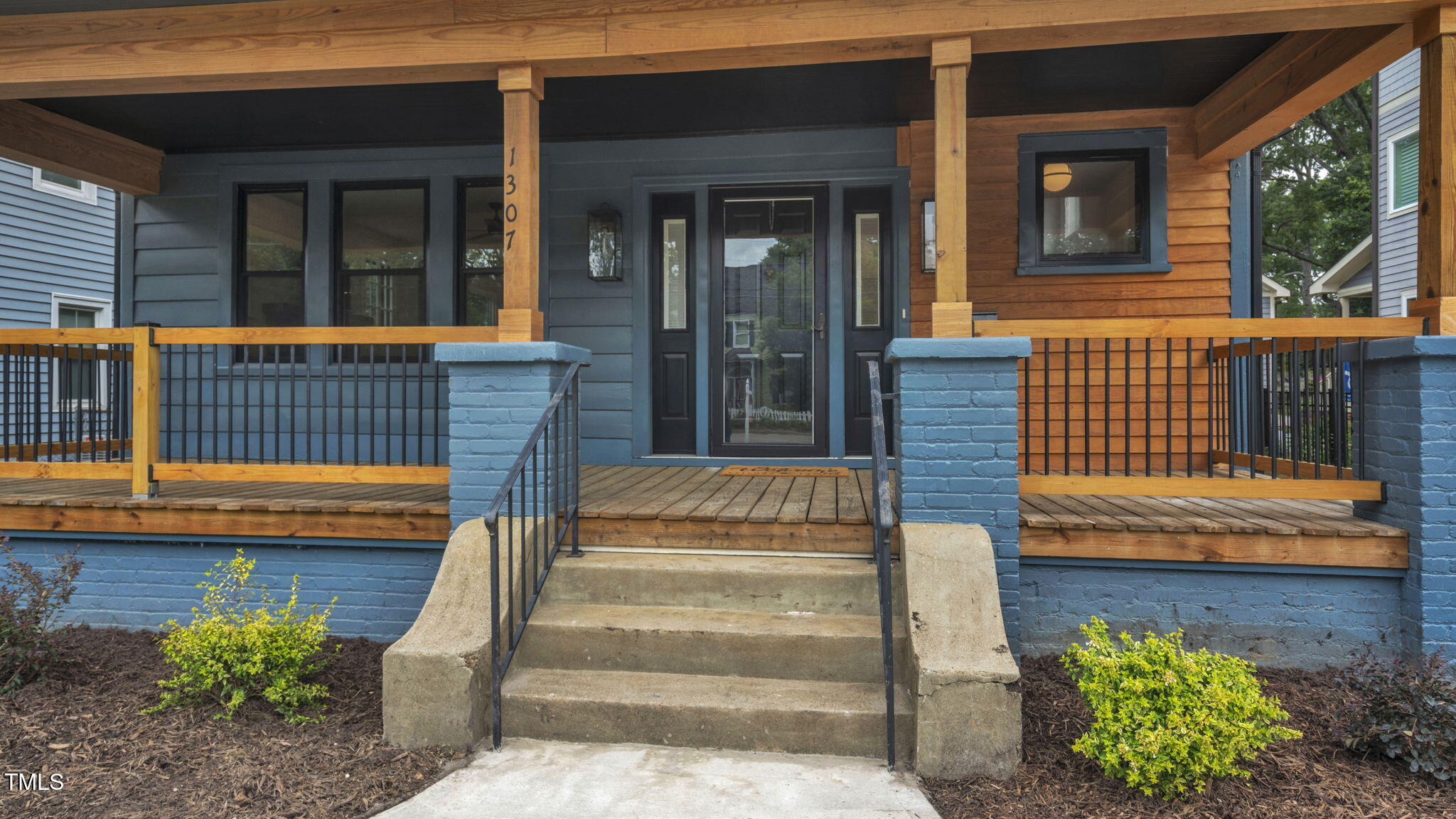 1307 Wake Forest Road Raleigh, NC 27604 - Photo 4 of 52 a view of a house with a large window and wooden floor