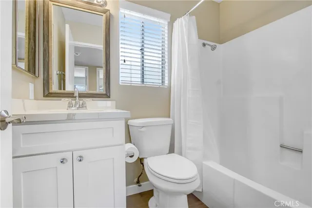 a bathroom with a sink toilet and vanity