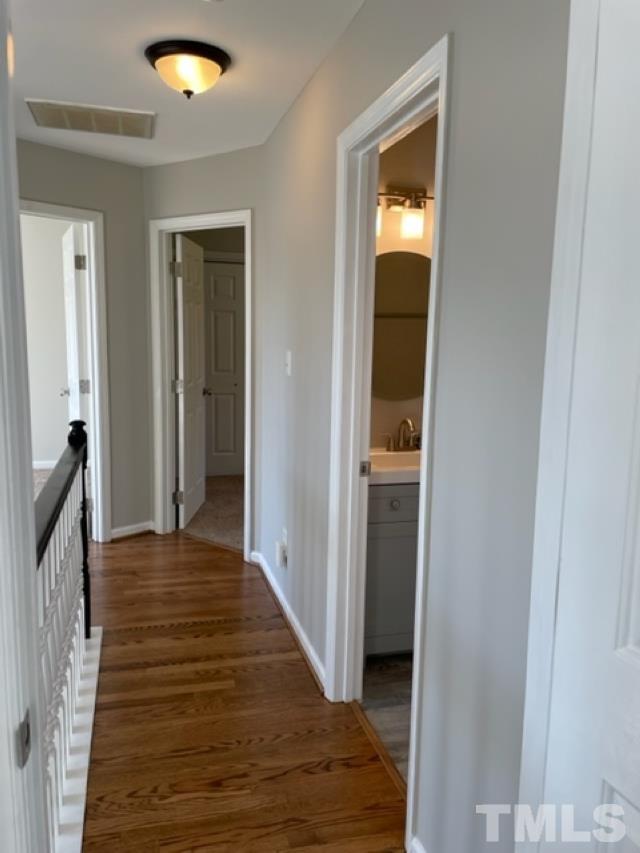 2409 Constitution Drive Raleigh, NC 27615 - Photo 12 of 16 Upstairs hallway with NEW hardwoods