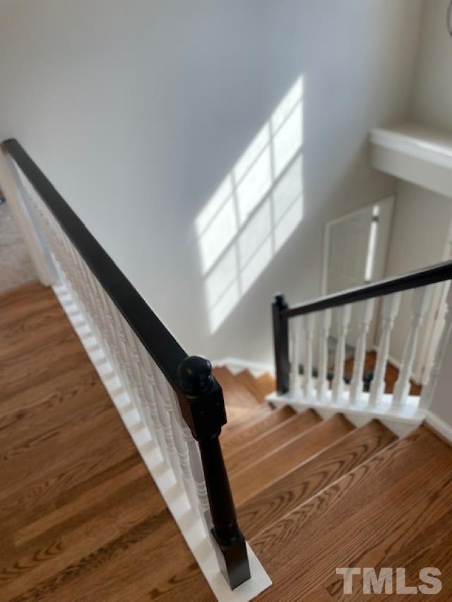 2409 Constitution Drive Raleigh, NC 27615 - Photo 10 of 16 Completely updated staircase with NEW hardwoods
