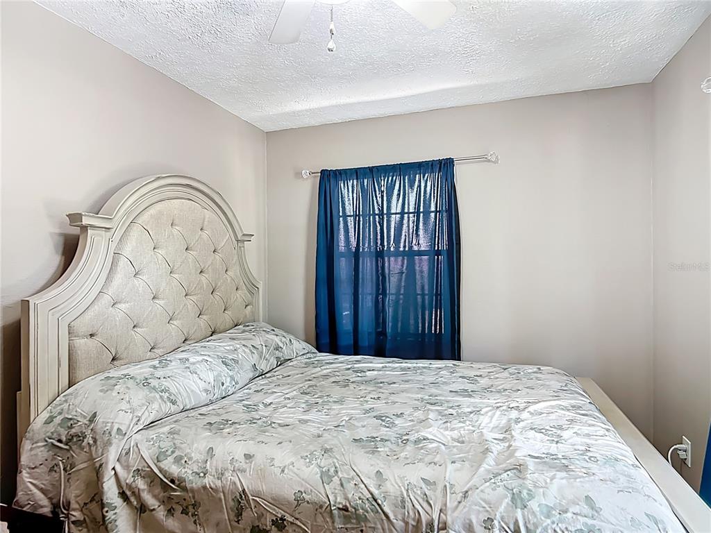 45 Forest Lane Bronson, FL 32621 - Photo 13 of 22 a bedroom with a bed and a window