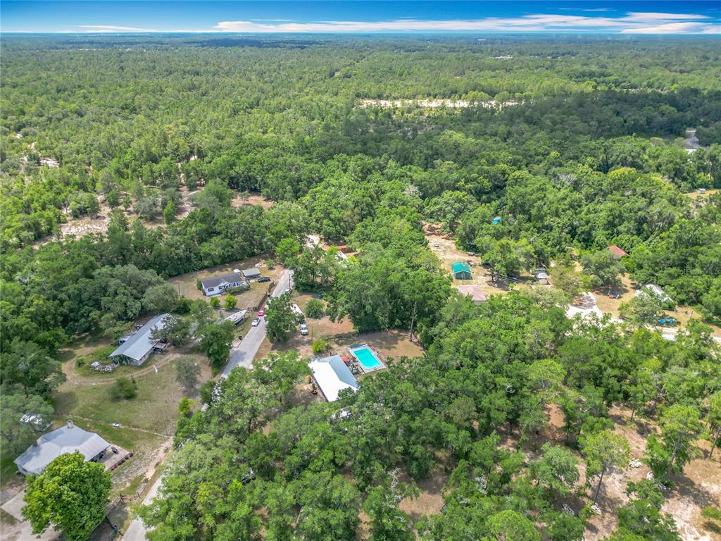45 Forest Lane Bronson, FL 32621 - Photo 22 of 22 a view of a city with lush green forest