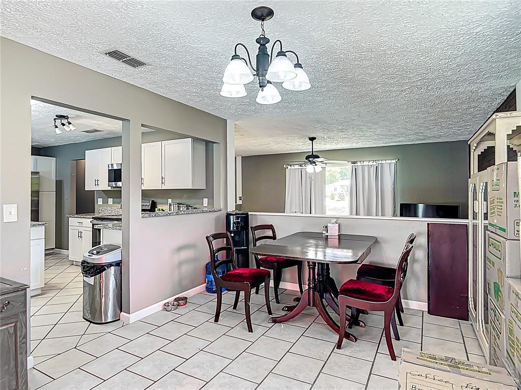 45 Forest Lane Bronson, FL 32621 - Photo 5 of 22 a view of a dining room with furniture