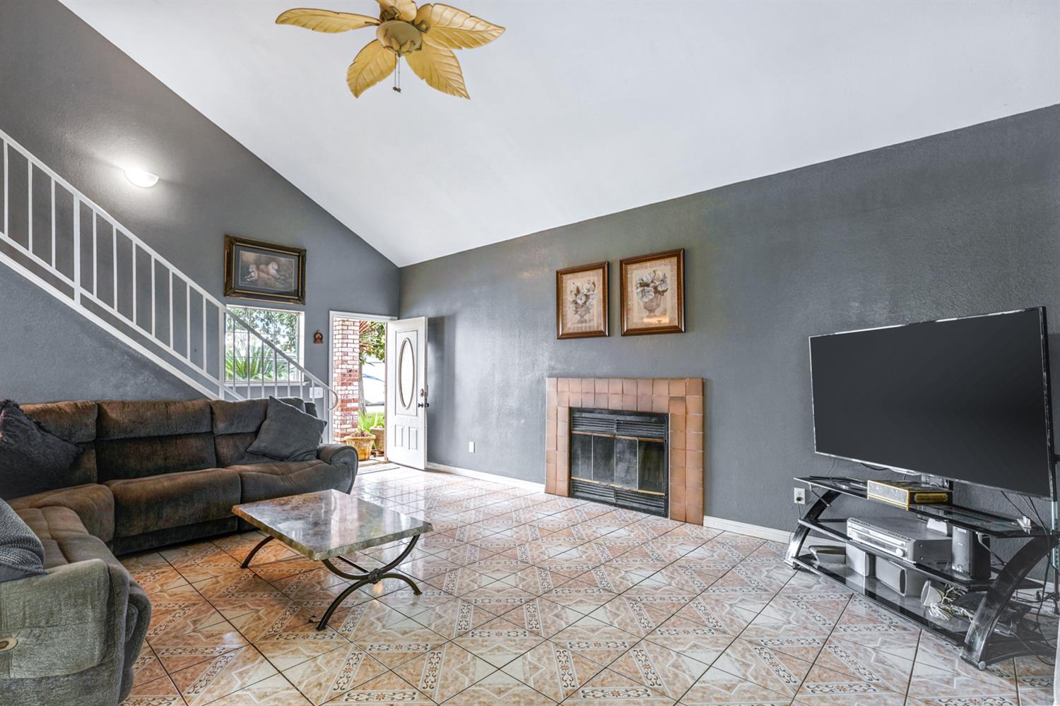 1755 3rd Street Lincoln, CA 95648 - Photo 3 of 22 a living room with furniture and a flat screen tv