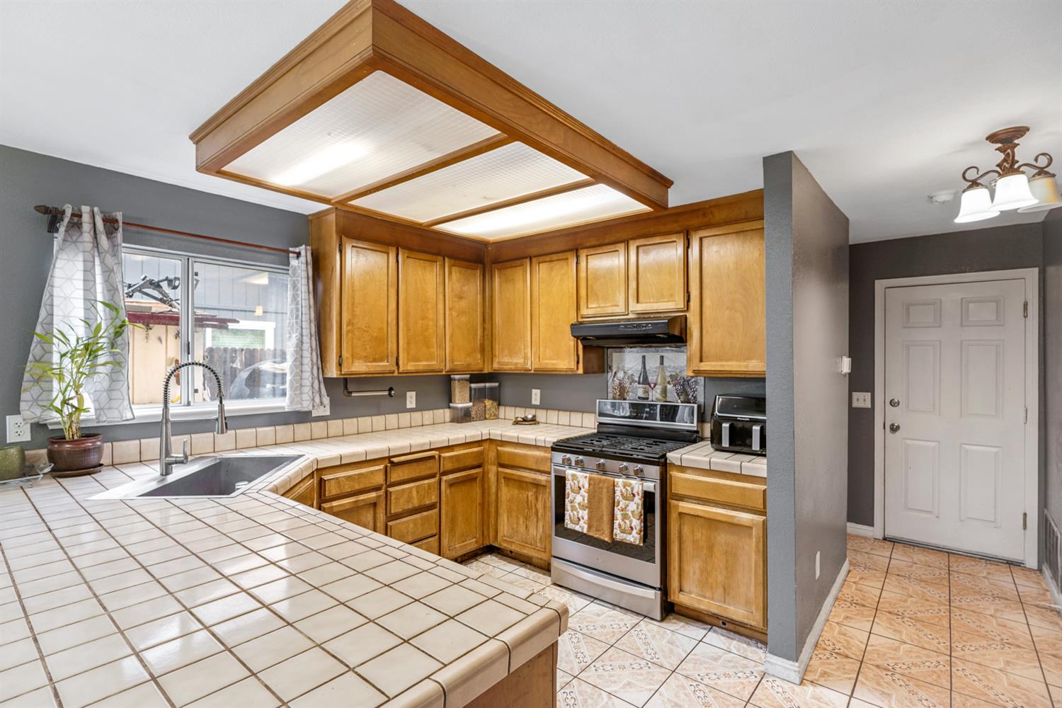 1755 3rd Street Lincoln, CA 95648 - Photo 8 of 22 a kitchen with stainless steel appliances granite countertop a sink and cabinets