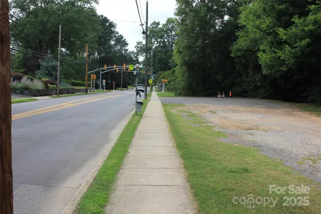 a view of flowing water with large trees
