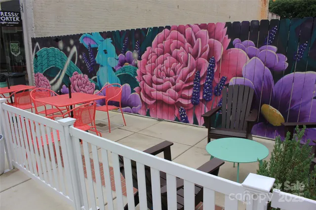 a view of path along with retail shop and buildings