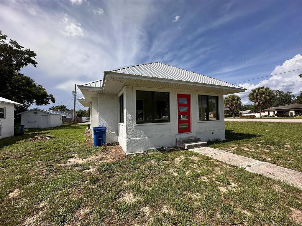107 Ave F Southwest Winter Haven, FL 33880 - Photo 20 of 21 a view of a house with backyard porch and garden