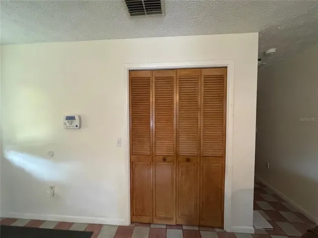 a kitchen with a refrigerator and a sink