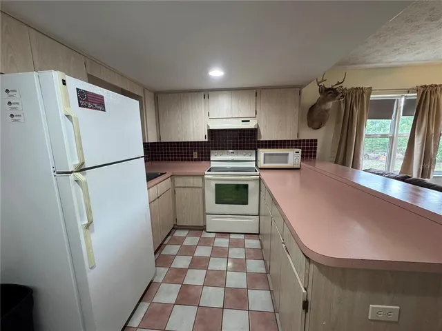 a view of a livingroom with furniture and window