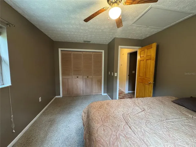 a room with a bed and window