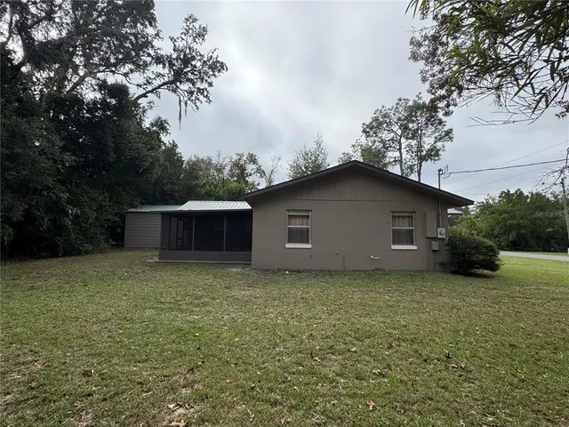 a house with trees in the background